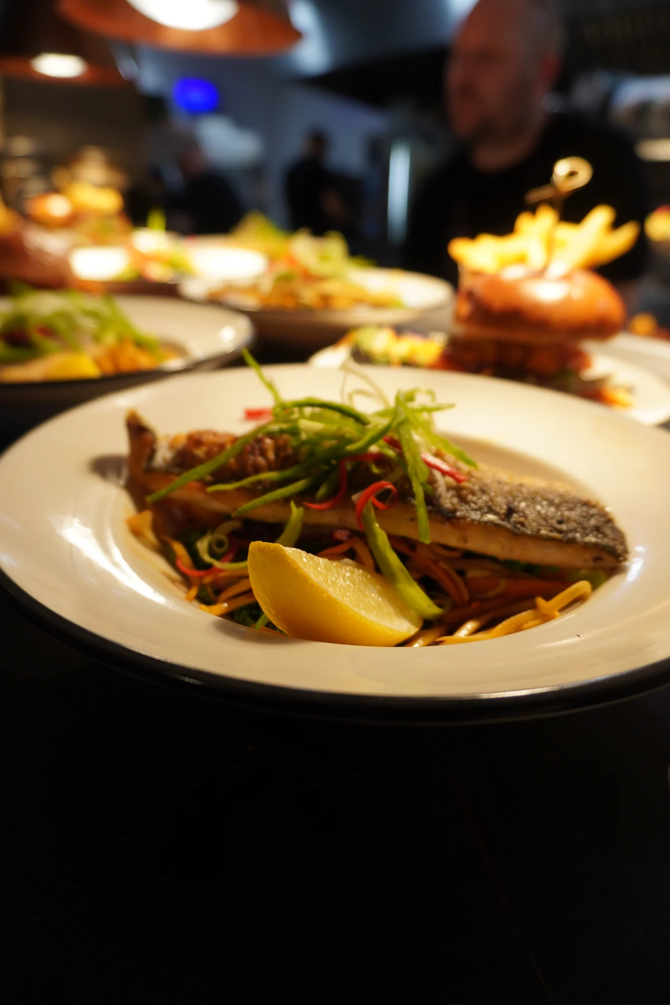 A plated fish dish ready for service at Black Rabbit