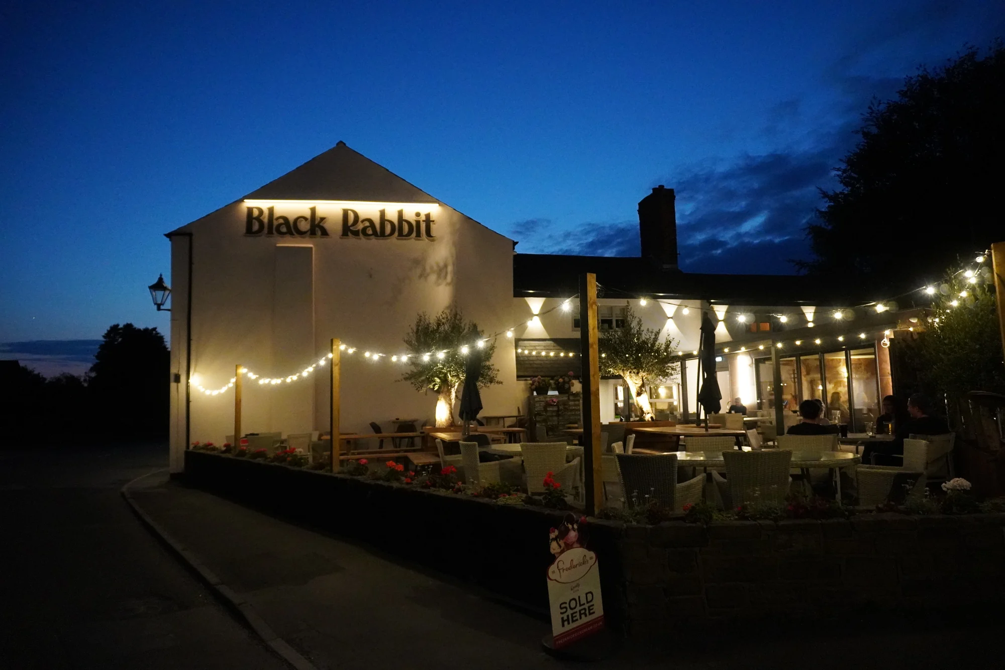 Black Rabbit’s terrace illuminated in the evening